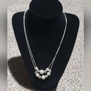 Silvertone double necklace with shamballa beads.